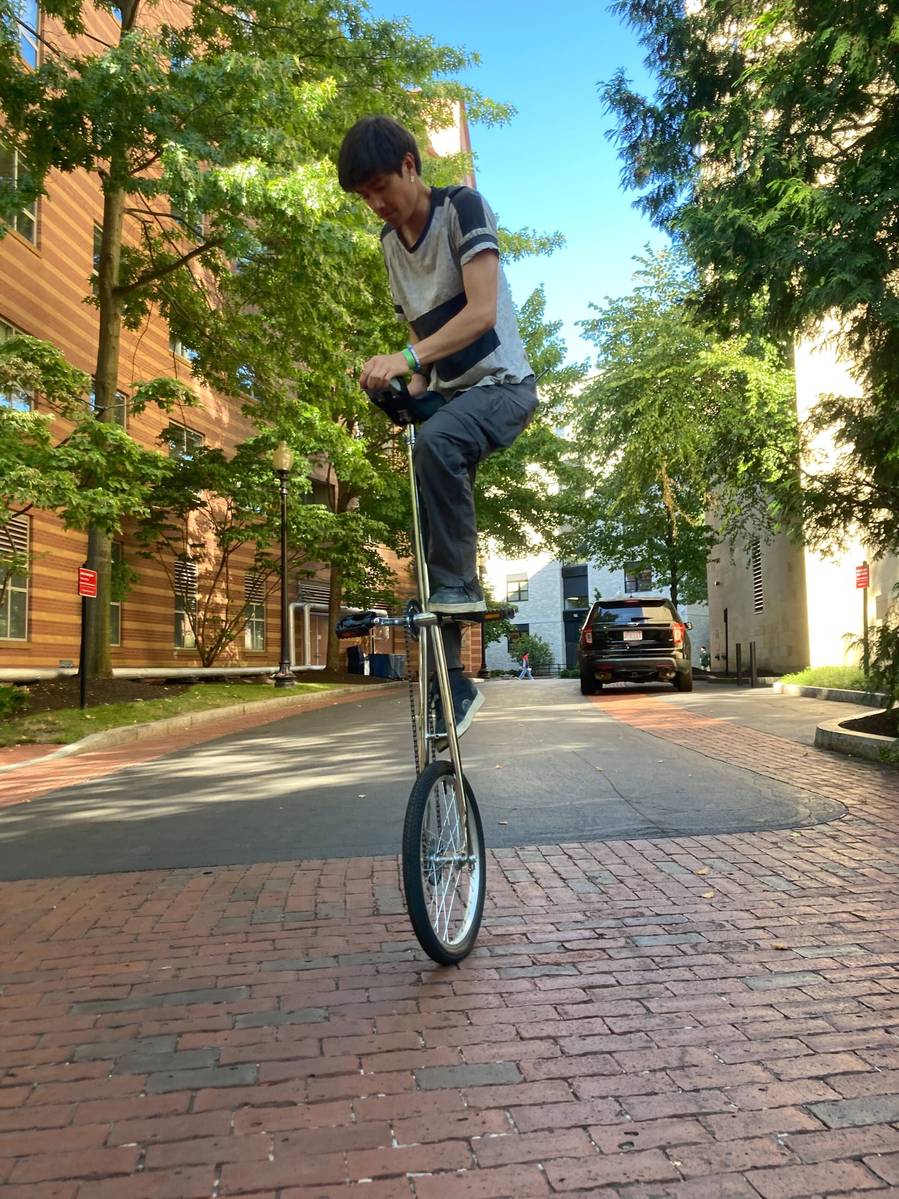 Me Mounting a tall Unicycle